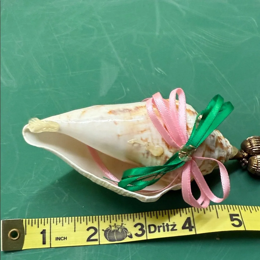 Elegant Shell Ornament with Pink and Green Accents